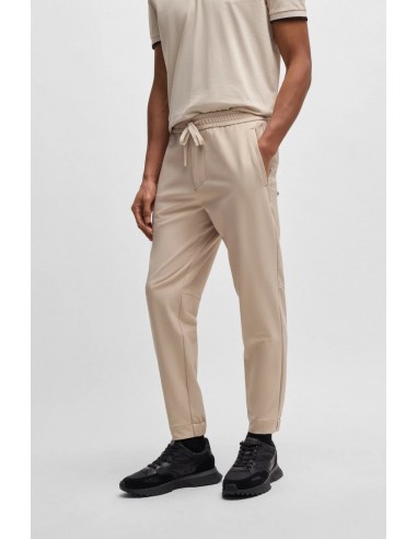 Pantalones tapered fit de tejido...